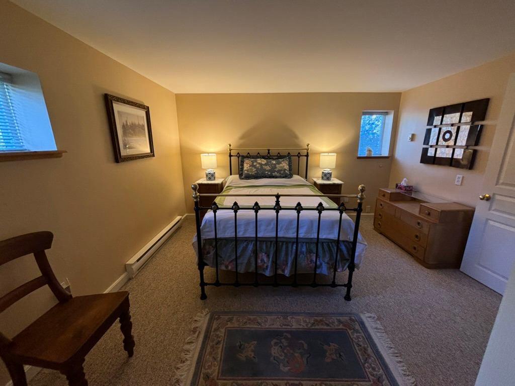 Pine Suite bedroom showing comfortable antique double bed 